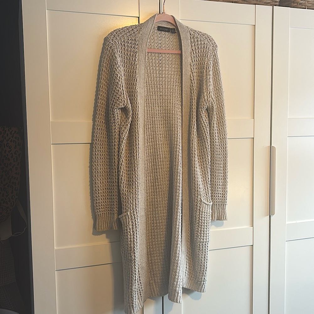 Cream coloured eclipse, knee length cardigan